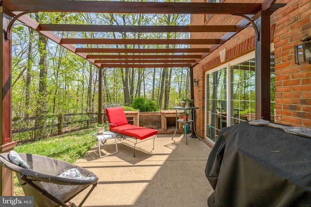 view of patio with a pergola, fence, and grilling area