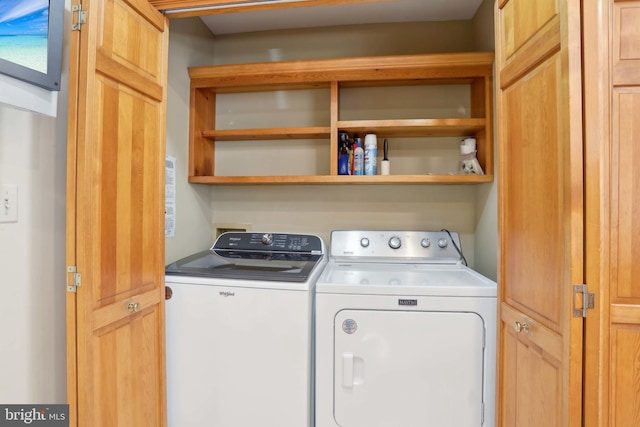 laundry room featuring washing machine and clothes dryer
