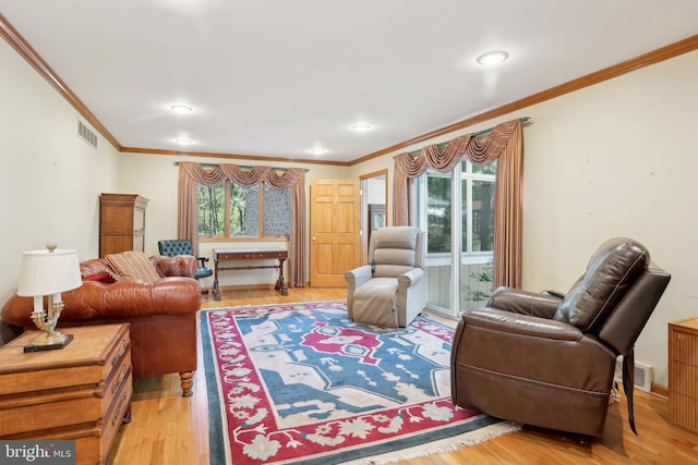 living room with crown molding, light wood finished floors, and recessed lighting