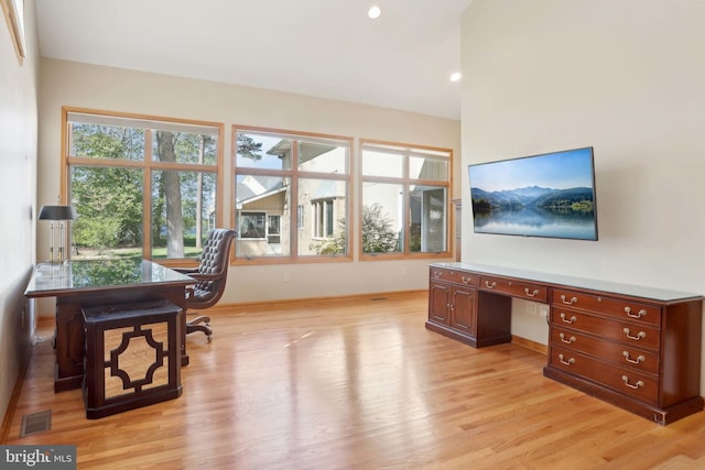 home office featuring light wood-style floors, baseboards, and recessed lighting