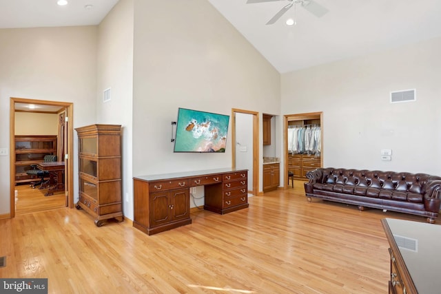 living room with high vaulted ceiling, a desk, a ceiling fan, light wood finished floors, and recessed lighting
