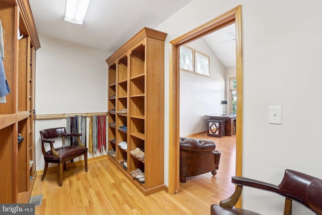sitting room featuring vaulted ceiling and light wood finished floors