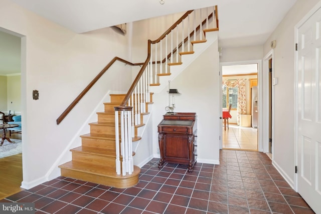 stairs featuring baseboards