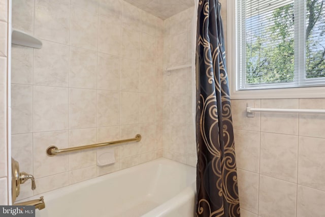bathroom featuring shower / tub combo with curtain