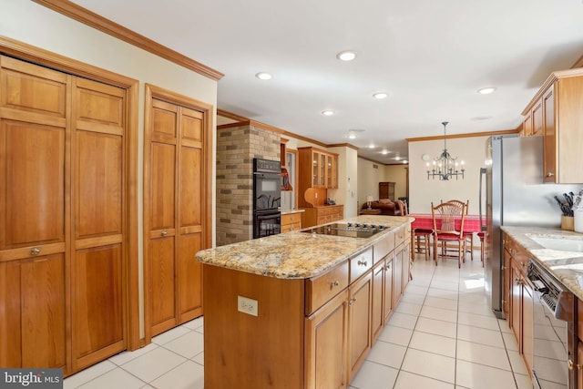kitchen featuring black appliances, a center island, crown molding, light tile patterned floors, and light stone countertops