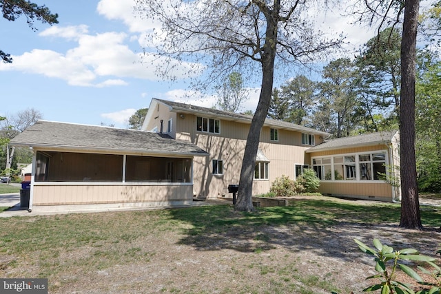 back of house featuring a sunroom