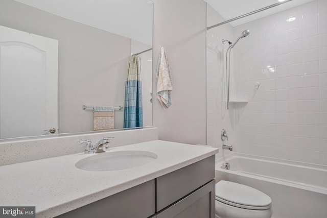 bathroom featuring vanity, shower / bath combo, and toilet