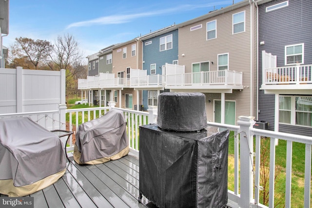 deck featuring a residential view and grilling area