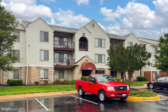 9552 Cannoneer Ct Unit 403, Manassas, VA 20110 - view of property featuring uncovered parking
