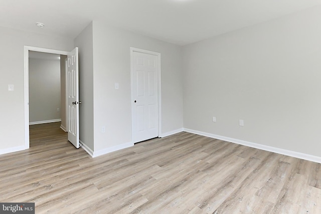 9552 Cannoneer Ct Unit 403, Manassas, VA 20110 - unfurnished bedroom with light wood-style flooring and baseboards