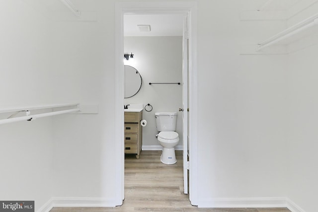 9552 Cannoneer Ct Unit 403, Manassas, VA 20110 - bathroom with toilet, vanity, wood finished floors, and baseboards