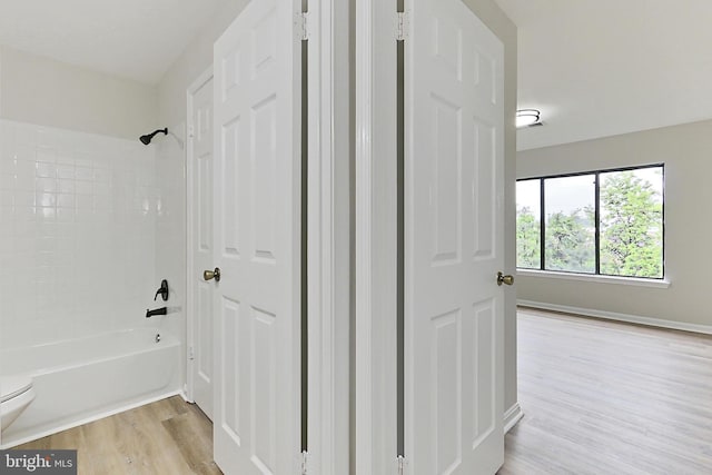 9552 Cannoneer Ct Unit 403, Manassas, VA 20110 - bathroom with wood finished floors, shower / bathtub combination, toilet, and baseboards