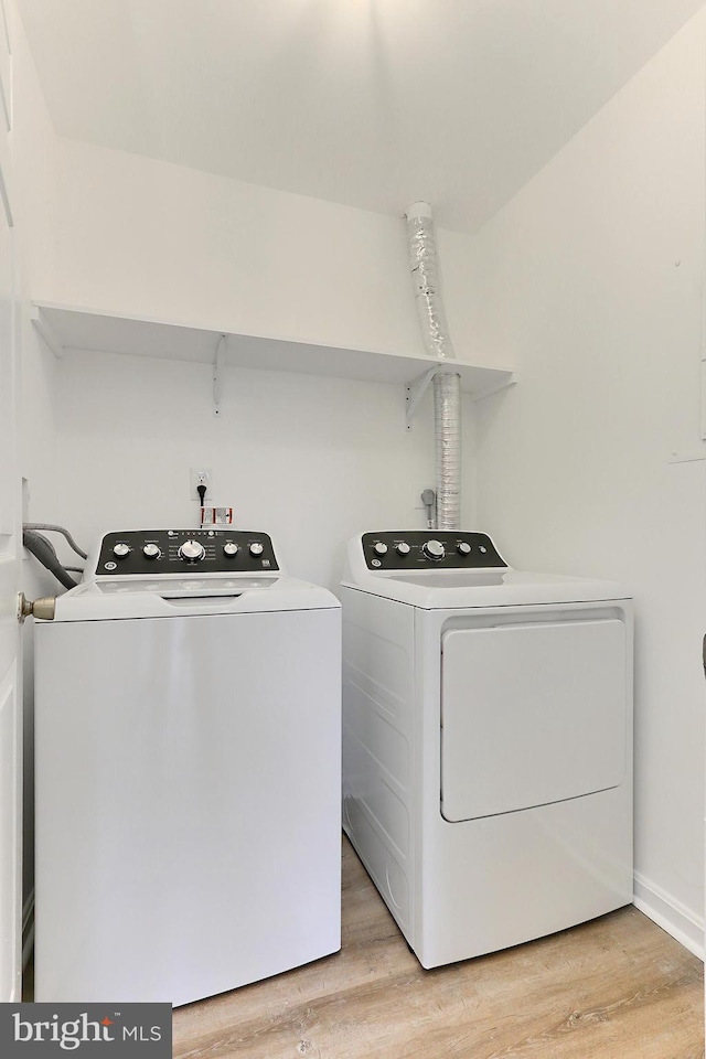 9552 Cannoneer Ct Unit 403, Manassas, VA 20110 - laundry room featuring separate washer and dryer, light wood-type flooring, and baseboards