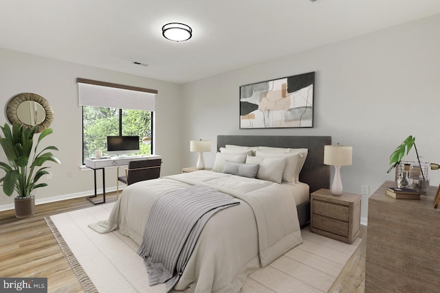 9552 Cannoneer Ct Unit 403, Manassas, VA 20110 - bedroom with wood finished floors and baseboards