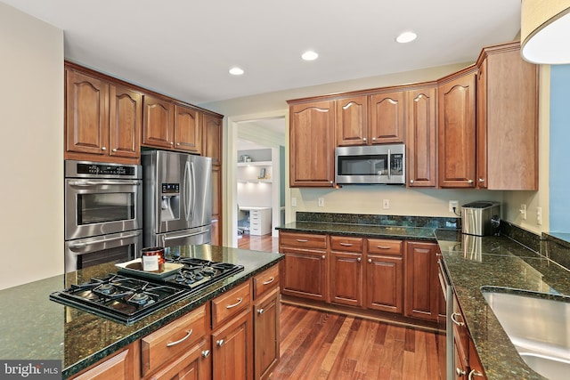 11373 Bishops Gate Ln, Laurel, MD 20723 - kitchen with appliances with stainless steel finishes, a sink, dark wood-style flooring, recessed lighting, and dark stone counters
