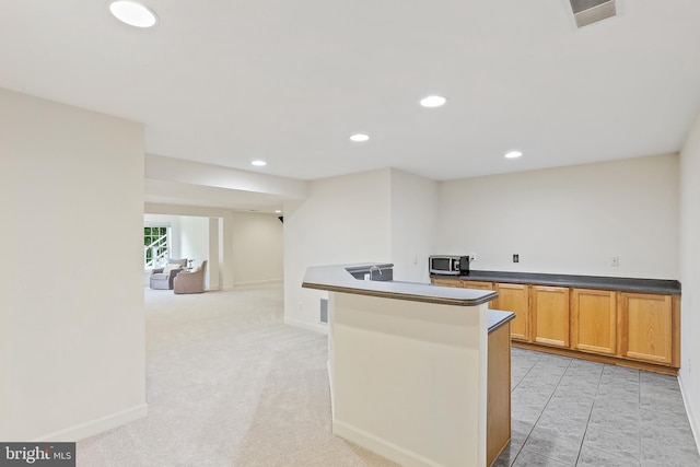 11373 Bishops Gate Ln, Laurel, MD 20723 - kitchen with stainless steel microwave, dark countertops, recessed lighting, and baseboards