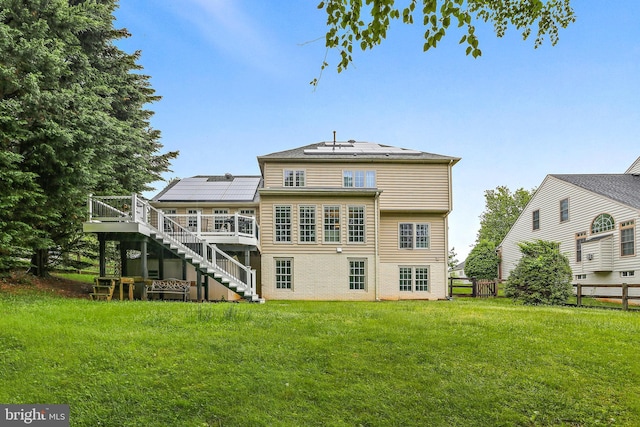 11373 Bishops Gate Ln, Laurel, MD 20723 - back of house featuring stairs, a wooden deck, and solar panels