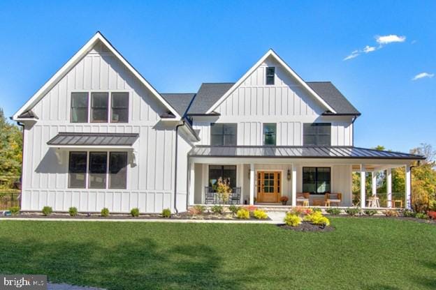 13 Sugarvale Way, Lutherville Timonium, MD 21093 - exterior space featuring a standing seam roof, a front lawn, a porch, metal roof, and board and batten siding