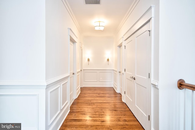 13 Sugarvale Way, Lutherville Timonium, MD 21093 - corridor featuring visible vents, ornamental molding, light wood-style floors, a decorative wall, and wainscoting