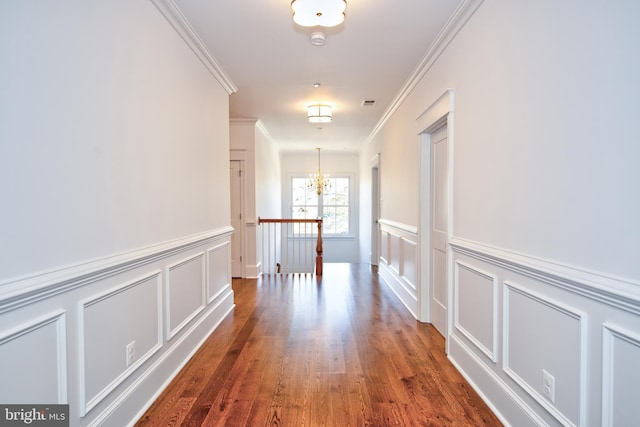 13 Sugarvale Way, Lutherville Timonium, MD 21093 - hall with a decorative wall, crown molding, wood finished floors, and an inviting chandelier