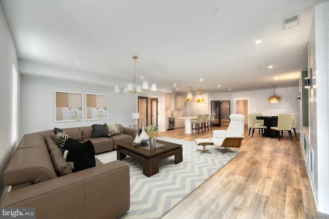 13 Sugarvale Way, Lutherville Timonium, MD 21093 - living room featuring recessed lighting, an inviting chandelier, visible vents, and light wood-type flooring