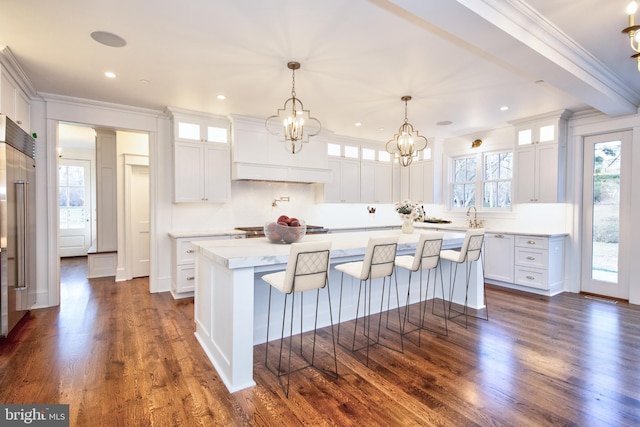 13 Sugarvale Way, Lutherville Timonium, MD 21093 - kitchen featuring white cabinets, dark wood finished floors, light countertops, crown molding, and a center island