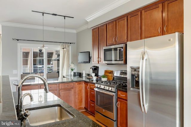 2331 Cambridge Walk, Baltimore, MD 21224 - kitchen with stainless steel appliances, a sink, dark stone counters, crown molding, and track lighting