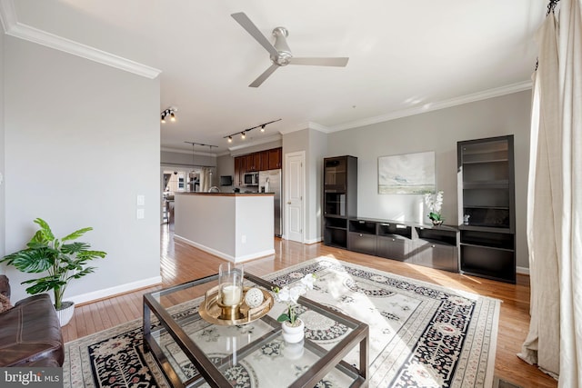 2331 Cambridge Walk, Baltimore, MD 21224 - living area featuring baseboards, light wood-style floors, ceiling fan, crown molding, and track lighting