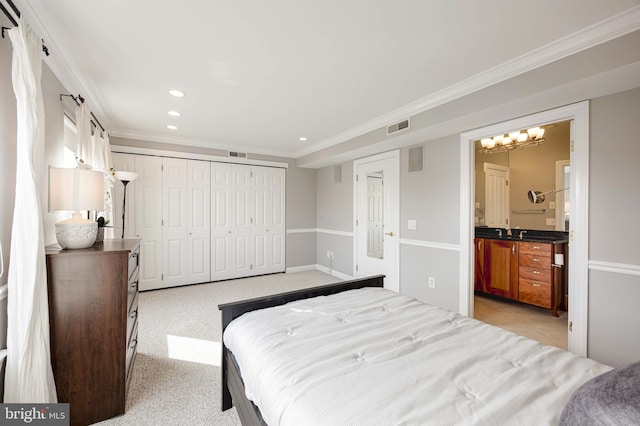2331 Cambridge Walk, Baltimore, MD 21224 - bedroom featuring ornamental molding, a sink, visible vents, and a closet