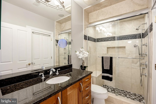 2331 Cambridge Walk, Baltimore, MD 21224 - bathroom featuring vanity, a shower stall, and toilet