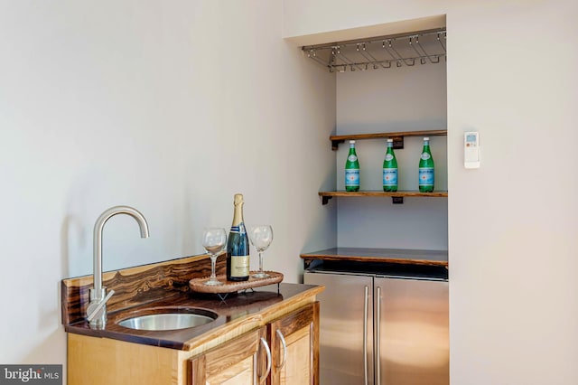 2331 Cambridge Walk, Baltimore, MD 21224 - bar featuring high end refrigerator, a bar, and a sink