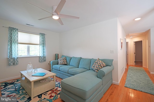 living room with a ceiling fan, light wood-style flooring, baseboards, and recessed lighting