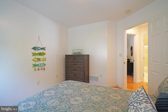 bedroom featuring wood finished floors