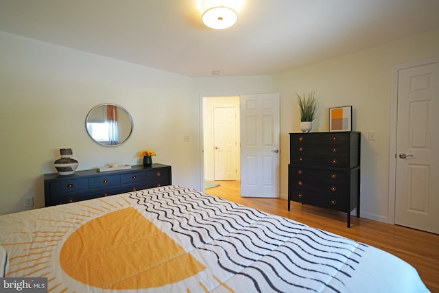 bedroom with wood finished floors