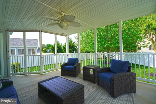 sunroom / solarium with a ceiling fan and an outdoor hangout area