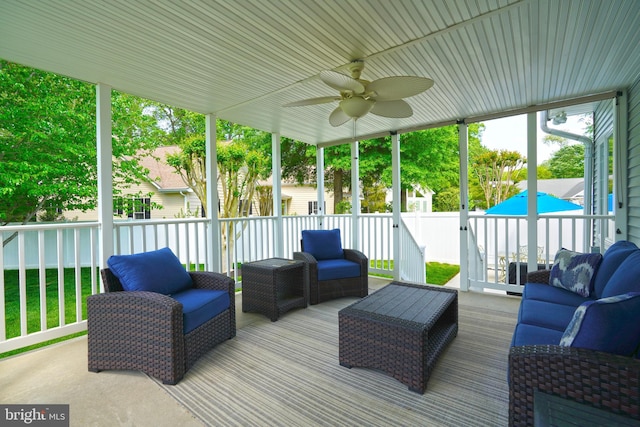 sunroom / solarium with an outdoor living space and ceiling fan