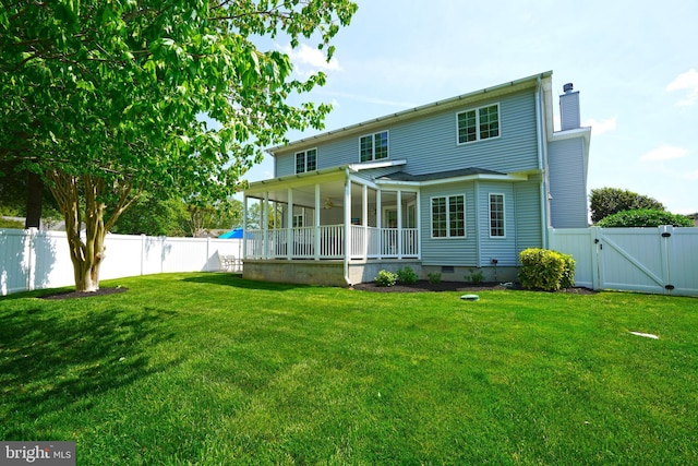 back of property with a gate, a chimney, and crawl space