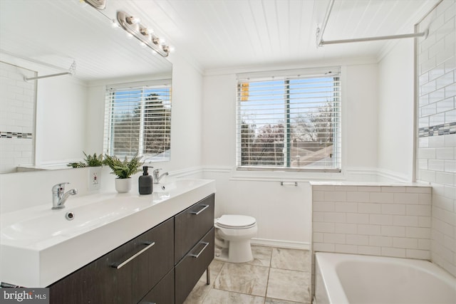 6813 Chestnut Ave, Falls Church, VA 22042 - bathroom featuring crown molding, a bathing tub, and a sink