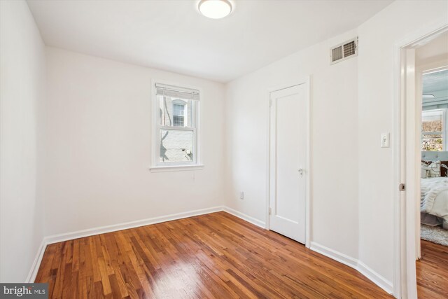 6813 Chestnut Ave, Falls Church, VA 22042 - unfurnished bedroom featuring wood finished floors, visible vents, and baseboards