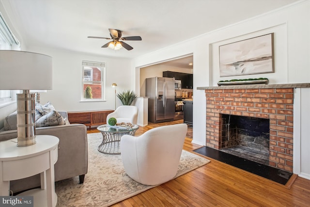6813 Chestnut Ave, Falls Church, VA 22042 - living area with a fireplace, wood finished floors, and a ceiling fan