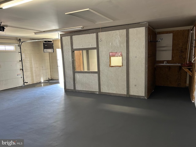 6813 Chestnut Ave, Falls Church, VA 22042 - garage with concrete block wall and a garage door opener