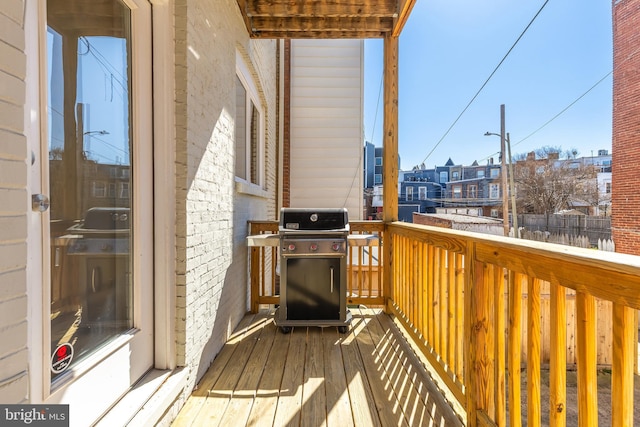 balcony with a residential view and area for grilling