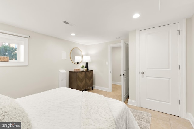 bedroom featuring baseboards, visible vents, recessed lighting, and light tile patterned floors