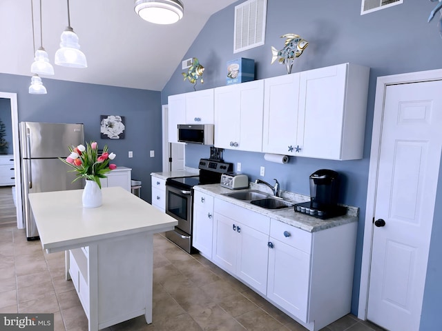 2508 Old House Point Rd, Fishing Creek, MD 21634 - kitchen with visible vents, a center island, light countertops, a sink, and appliances with stainless steel finishes
