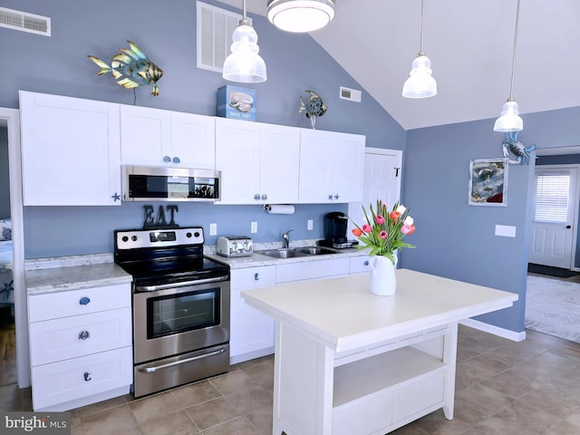 2508 Old House Point Rd, Fishing Creek, MD 21634 - kitchen with visible vents, high vaulted ceiling, light countertops, a sink, and appliances with stainless steel finishes
