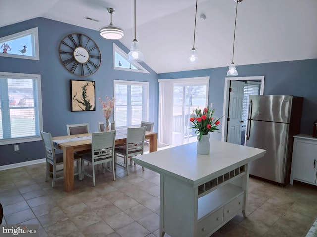 2508 Old House Point Rd, Fishing Creek, MD 21634 - kitchen with light countertops, a center island, freestanding refrigerator, and vaulted ceiling