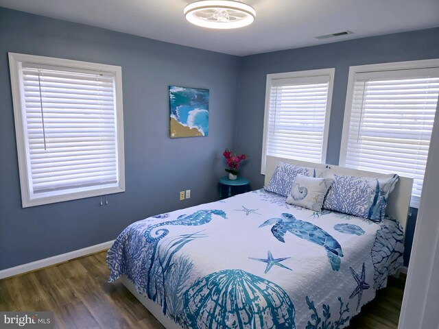 2508 Old House Point Rd, Fishing Creek, MD 21634 - bedroom with baseboards, wood finished floors, and visible vents