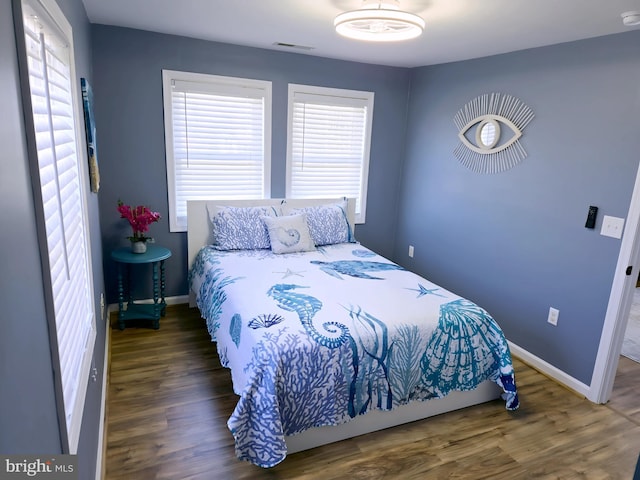 2508 Old House Point Rd, Fishing Creek, MD 21634 - bedroom with visible vents, baseboards, and wood finished floors