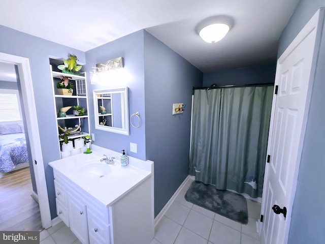 2508 Old House Point Rd, Fishing Creek, MD 21634 - bathroom with vanity, tile patterned flooring, baseboards, and a shower with curtain