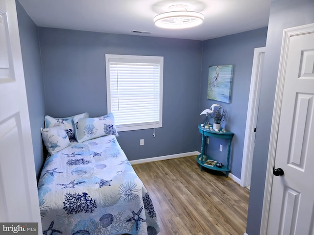 2508 Old House Point Rd, Fishing Creek, MD 21634 - bedroom with visible vents, baseboards, and wood finished floors